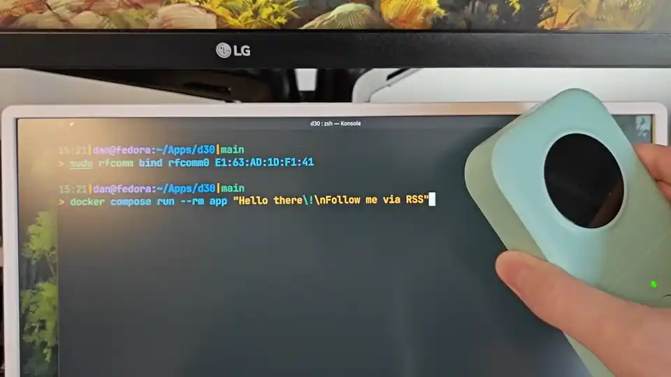 Animation showing running a command, with a label printing from the portable printer
